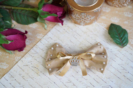 Cream and gold colored hairpin